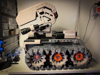 a robot with wheels on top of a shelf