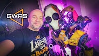 a man is posing next to a robot with the words gwas